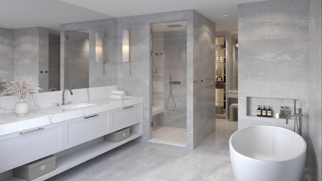 Modern bathroom with gray tiles, white fixtures, and a shower area.