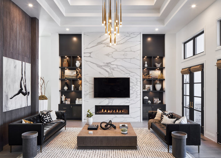 Modern living room with black sofa, wooden coffee table, and marble fireplace.